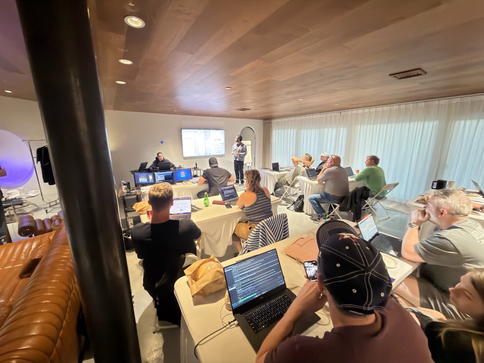 Vegas 2026 workroom: operators at long tables with laptops open, screens at the front
