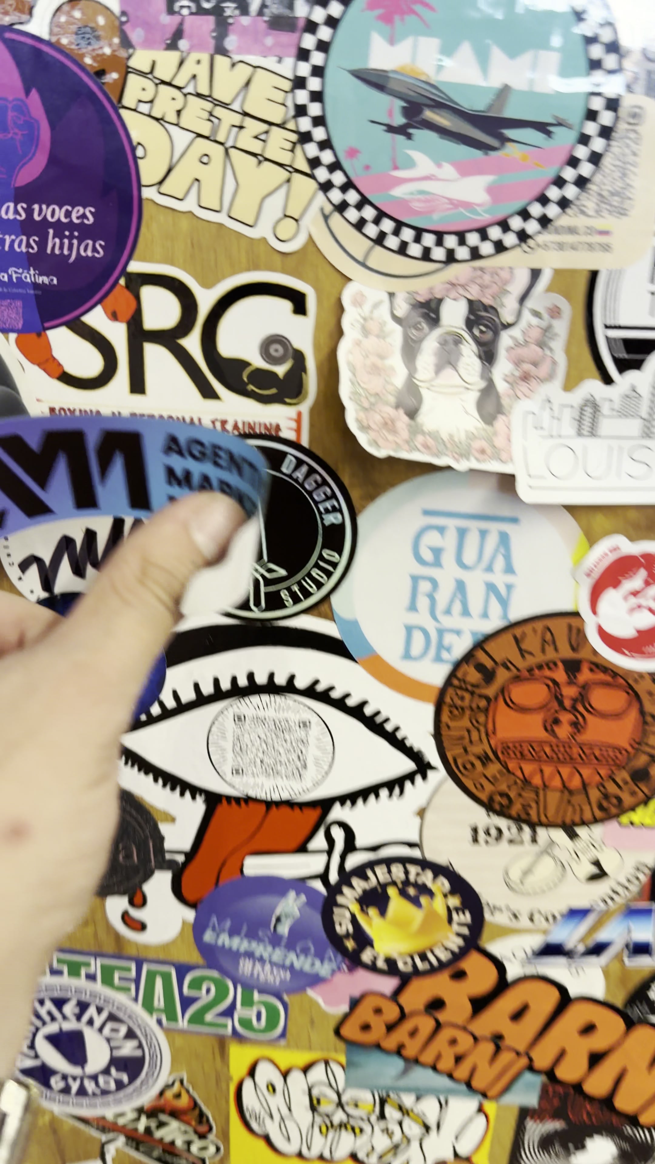 Agentic Marketing sticker peel on a sticker-bombed door